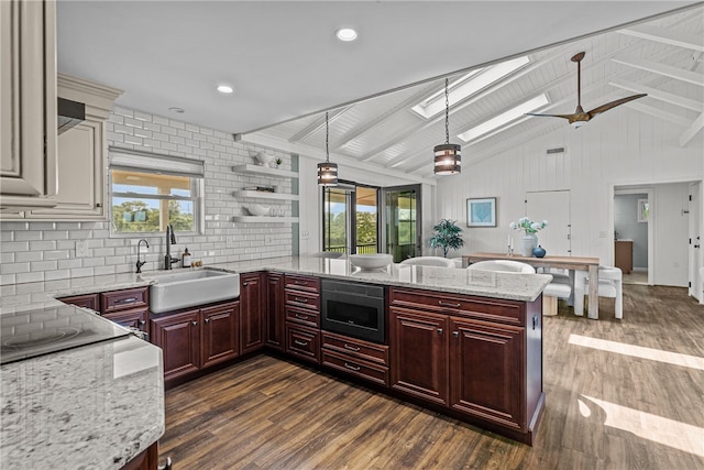 212 Round Pond Rd, Little Compton, RI 02837 - kitchen featuring stainless steel microwave, reddish brown cabinets, dark wood-type flooring, tasteful backsplash, and healthy amount of natural light