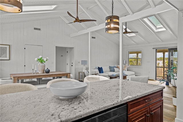212 Round Pond Rd, Little Compton, RI 02837 - kitchen with a skylight, light wood-style flooring, open floor plan, a ceiling fan, and beam ceiling
