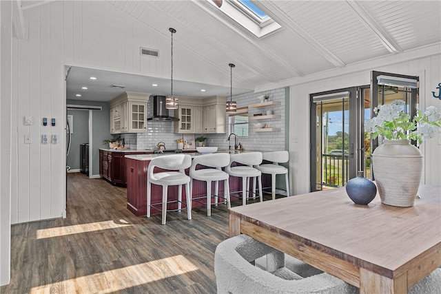 212 Round Pond Rd, Little Compton, RI 02837 - dining room with a skylight, dark wood-style flooring, beamed ceiling, and high vaulted ceiling