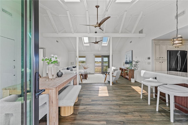 212 Round Pond Rd, Little Compton, RI 02837 - living area featuring high vaulted ceiling, dark wood-style flooring, a skylight, a ceiling fan, and beam ceiling