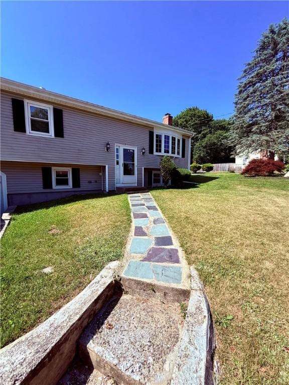 46 Broadview Ave, Cumberland, RI 02864 - raised ranch featuring a front yard and a chimney