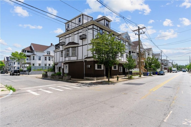 129 Academy Ave, Providence, RI 02908 - view of asphalt road featuring a residential view, sidewalks, and curbs