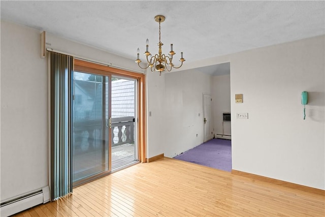 129 Academy Ave, Providence, RI 02908 - unfurnished room with baseboard heating, a chandelier, and hardwood / wood-style flooring