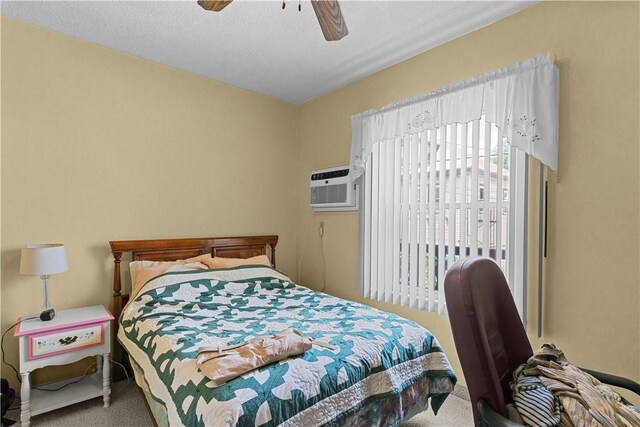 129 Academy Ave, Providence, RI 02908 - carpeted bedroom featuring an AC wall unit and ceiling fan