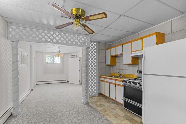 129 Academy Ave, Providence, RI 02908 - kitchen featuring freestanding refrigerator, gas range, and a baseboard radiator