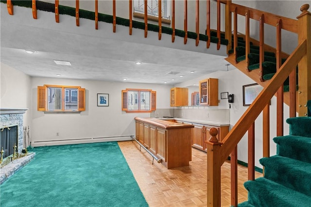 129 Academy Ave, Providence, RI 02908 - bar featuring baseboard heating, stairs, and a fireplace