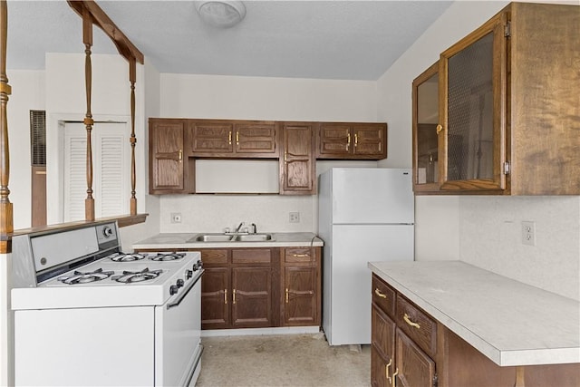 129 Academy Ave, Providence, RI 02908 - kitchen featuring white appliances, light countertops, and glass insert cabinets