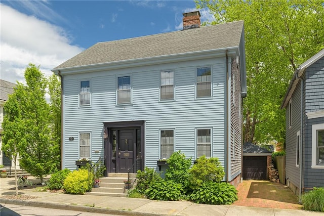 47 Second St, Newport, RI 02840 - colonial-style house featuring a chimney, a detached garage, an outbuilding, and a shingled roof