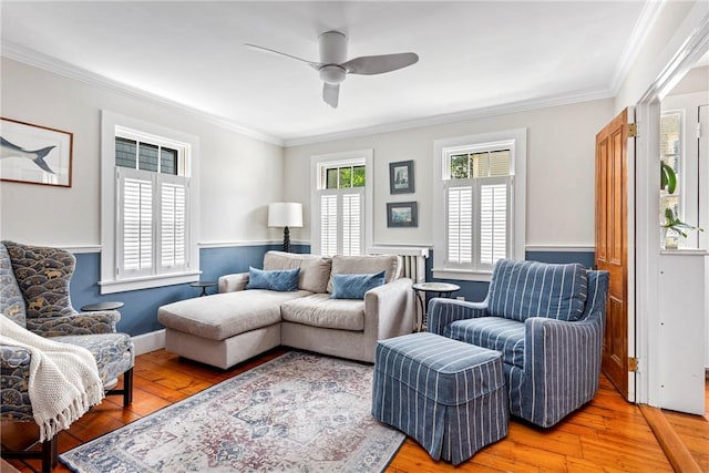 47 Second St, Newport, RI 02840 - living room with light wood-type flooring, crown molding, and a ceiling fan