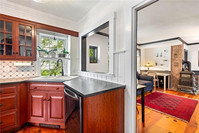 47 Second St, Newport, RI 02840 - kitchen featuring stainless steel dishwasher, dark wood-style flooring, glass insert cabinets, backsplash, and crown molding