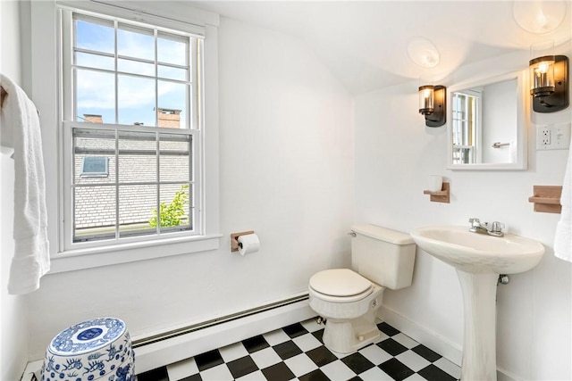 47 Second St, Newport, RI 02840 - half bathroom featuring a baseboard heating unit, tile patterned floors, healthy amount of natural light, and lofted ceiling