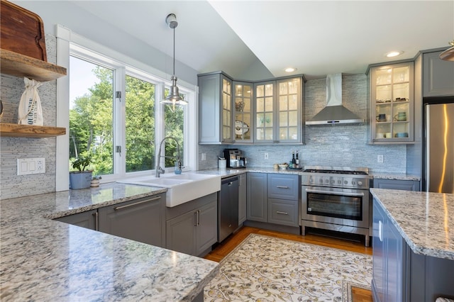 170 W Beach Rd, Charlestown, RI 02813 - kitchen with wall chimney range hood, appliances with stainless steel finishes, open shelves, gray cabinets, and decorative backsplash