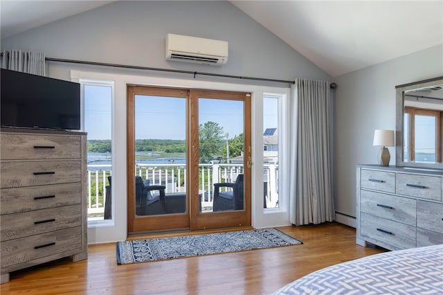 170 W Beach Rd, Charlestown, RI 02813 - bedroom featuring a wall mounted AC, vaulted ceiling, access to outside, multiple windows, and baseboard heating