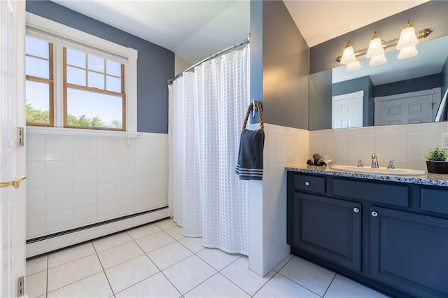 170 W Beach Rd, Charlestown, RI 02813 - bathroom with tile walls, baseboard heating, lofted ceiling, vanity, and tile patterned floors