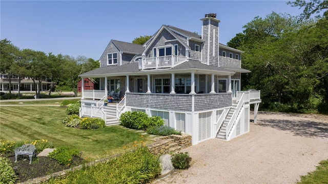 170 W Beach Rd, Charlestown, RI 02813 - shingle-style home with stairway, a balcony, a porch, a front lawn, and a chimney