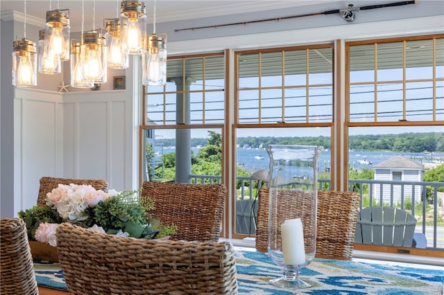 170 W Beach Rd, Charlestown, RI 02813 - dining space with ornamental molding, a decorative wall, wainscoting, and a water view
