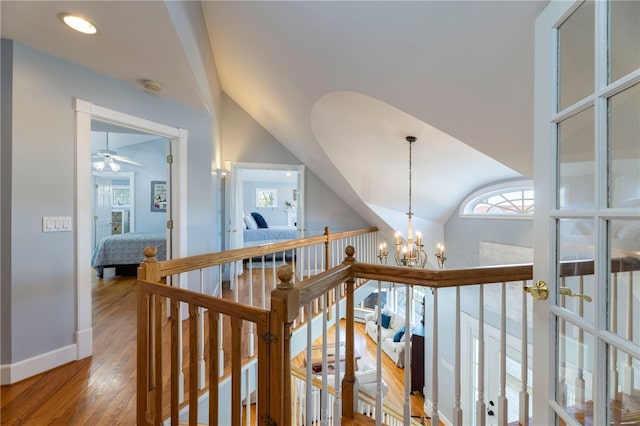 170 W Beach Rd, Charlestown, RI 02813 - hall featuring an upstairs landing, wood finished floors, and a chandelier