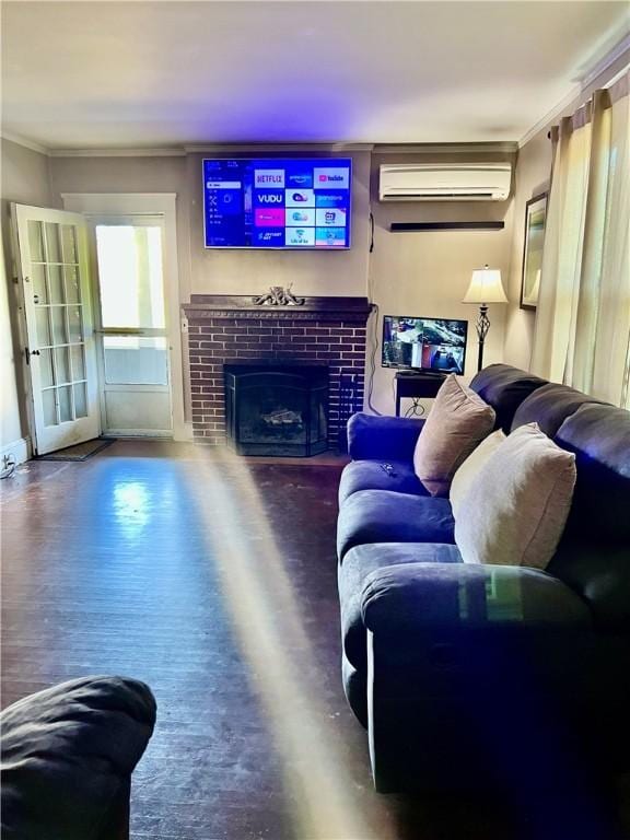 145 Olney Ave, North Providence, RI 02911 - living room with a wall unit AC, crown molding, a tile fireplace, and wood finished floors