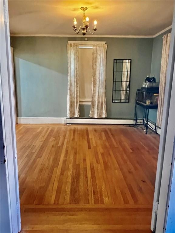 145 Olney Ave, North Providence, RI 02911 - unfurnished dining area with ornamental molding, wood finished floors, and a chandelier