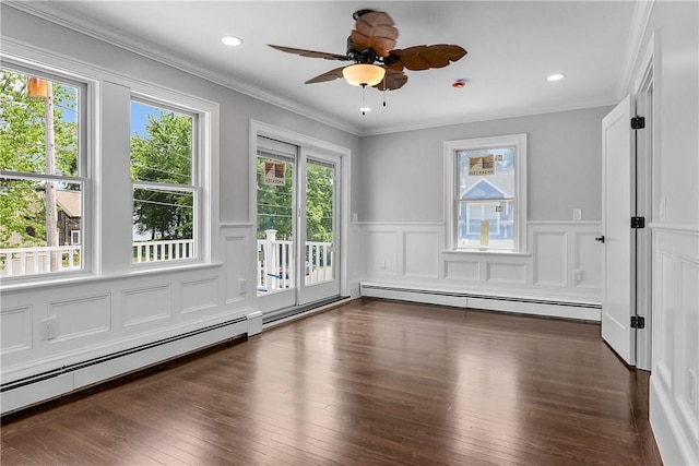 201 Bellman Ave, Warwick, RI 02889 - empty room with baseboard heating, healthy amount of natural light, a wainscoted wall, a ceiling fan, and crown molding