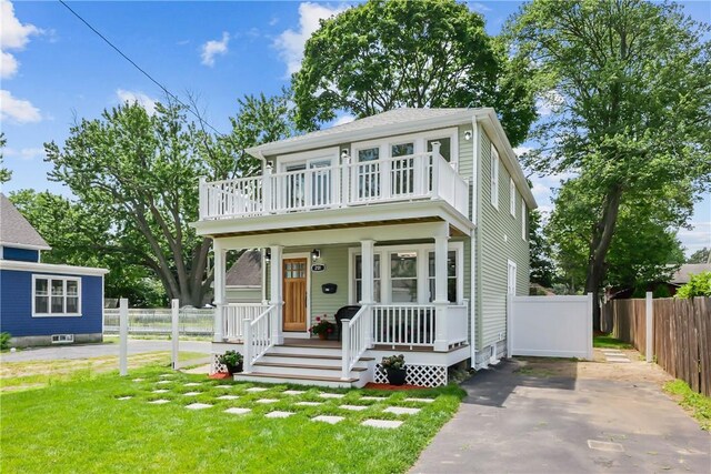201 Bellman Ave, Warwick, RI 02889 - view of front of home with covered porch, a balcony, and driveway