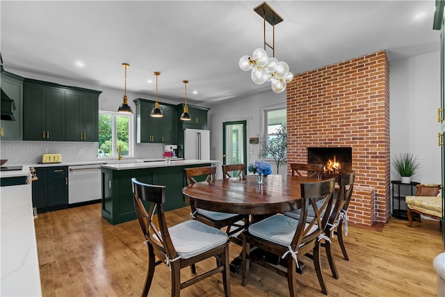 93 E Main Rd, Portsmouth, RI 02871 - dining area featuring light wood-type flooring, recessed lighting, and a fireplace