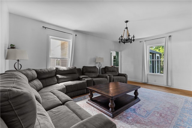 93 E Main Rd, Portsmouth, RI 02871 - living area featuring a chandelier and light wood-style floors