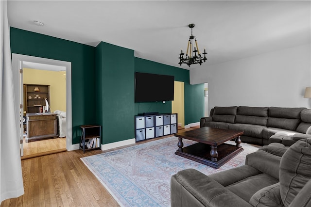 93 E Main Rd, Portsmouth, RI 02871 - living room with wood finished floors and a chandelier