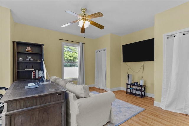 93 E Main Rd, Portsmouth, RI 02871 - living area with a ceiling fan, light wood-type flooring, and an office area