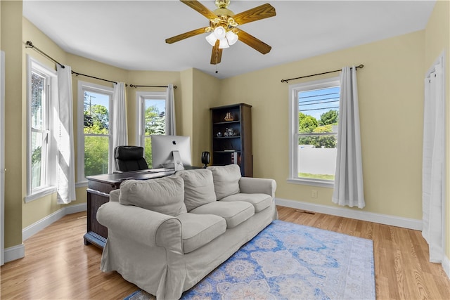 93 E Main Rd, Portsmouth, RI 02871 - living room with light wood-style flooring and ceiling fan