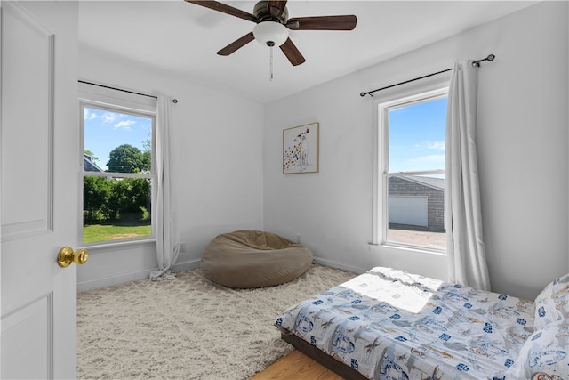 93 E Main Rd, Portsmouth, RI 02871 - bedroom with multiple windows and a ceiling fan