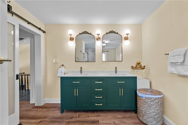 93 E Main Rd, Portsmouth, RI 02871 - bathroom with wood finished floors and double vanity