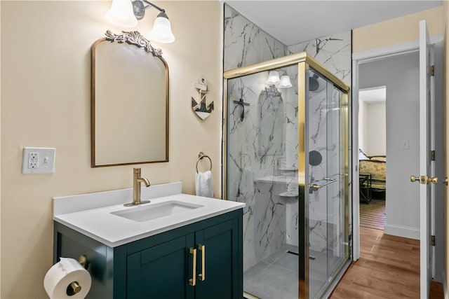 93 E Main Rd, Portsmouth, RI 02871 - full bathroom featuring vanity, a marble finish shower, and wood finished floors