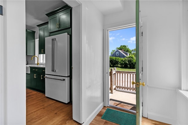 93 E Main Rd, Portsmouth, RI 02871 - doorway to outside featuring light wood-type flooring, plenty of natural light, and wainscoting