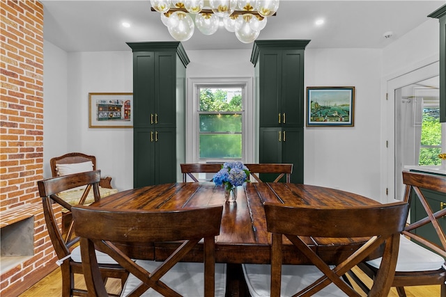 93 E Main Rd, Portsmouth, RI 02871 - dining space with a chandelier and light wood-style flooring