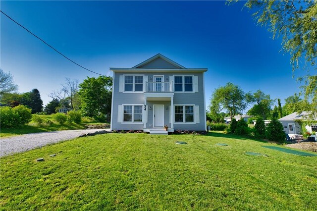 24 Seaspray Way, Little Compton, RI 02837 - view of front of property featuring a balcony, a front lawn, and driveway