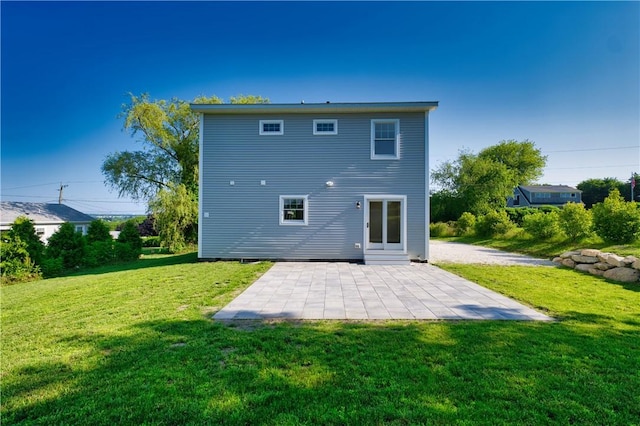 24 Seaspray Way, Little Compton, RI 02837 - rear view of house featuring a patio area and a yard