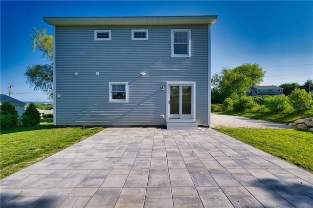 24 Seaspray Way, Little Compton, RI 02837 - back of house featuring a patio area and a yard