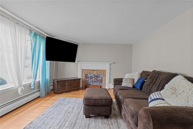 56 Brookfield Dr, Cranston, RI 02920 - living room featuring a baseboard radiator, wood finished floors, and a fireplace