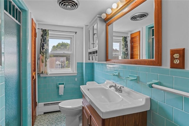 56 Brookfield Dr, Cranston, RI 02920 - bathroom with a baseboard heating unit, tile walls, vanity, a shower, and a wainscoted wall