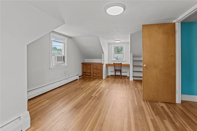 56 Brookfield Dr, Cranston, RI 02920 - additional living space with a baseboard radiator, a baseboard heating unit, light wood-style flooring, cooling unit, and vaulted ceiling
