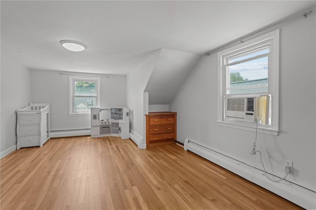 56 Brookfield Dr, Cranston, RI 02920 - additional living space featuring a baseboard heating unit, light wood-type flooring, cooling unit, and lofted ceiling