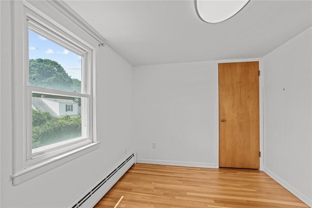 56 Brookfield Dr, Cranston, RI 02920 - spare room with baseboard heating and light wood-style flooring