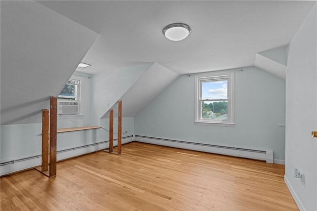 56 Brookfield Dr, Cranston, RI 02920 - additional living space with baseboard heating, wood finished floors, lofted ceiling, and cooling unit