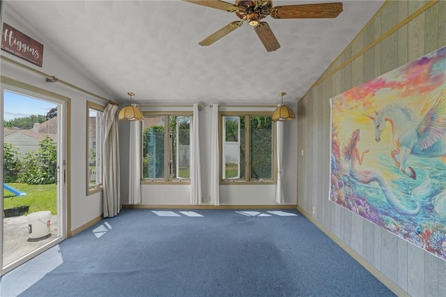 56 Brookfield Dr, Cranston, RI 02920 - carpeted spare room with vaulted ceiling, a ceiling fan, and wood walls