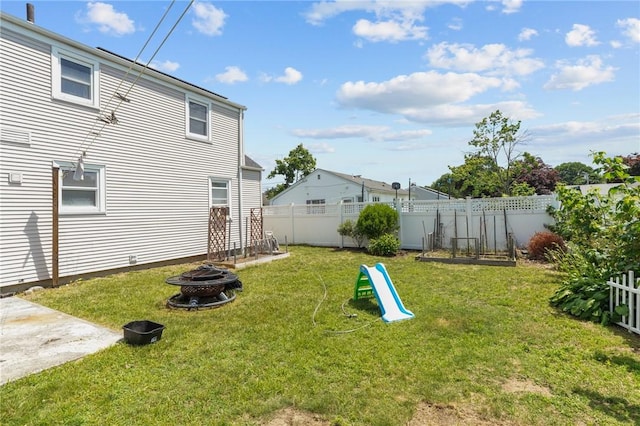 56 Brookfield Dr, Cranston, RI 02920 - fenced backyard featuring a fire pit