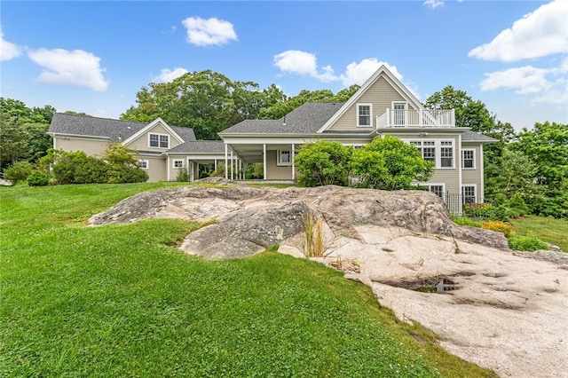 583 Highland Rd, Tiverton, RI 02878 - shingle-style home featuring a balcony and a front lawn