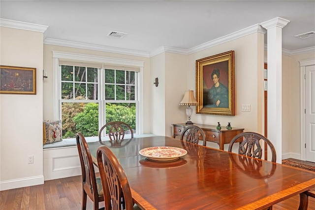 583 Highland Rd, Tiverton, RI 02878 - dining area featuring crown molding and dark wood-style flooring