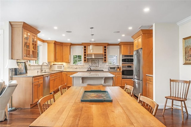 583 Highland Rd, Tiverton, RI 02878 - kitchen featuring stainless steel appliances, dark wood-type flooring, a kitchen island, tasteful backsplash, and recessed lighting