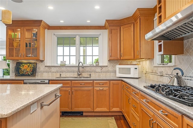 583 Highland Rd, Tiverton, RI 02878 - kitchen with white microwave, under cabinet range hood, gas stovetop, light stone counters, and decorative backsplash